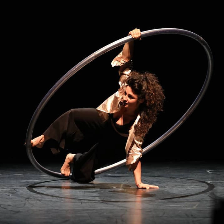 Marica Marinoni doing a cyr wheel trick